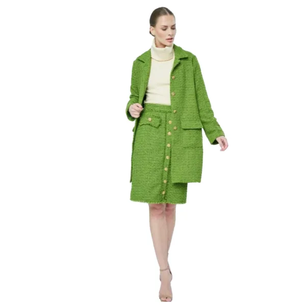 A woman wearing a green tweed coat and skirt.