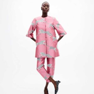 A model showcases a pink cat print suit, featuring silk wool side zip straight ankle pants.